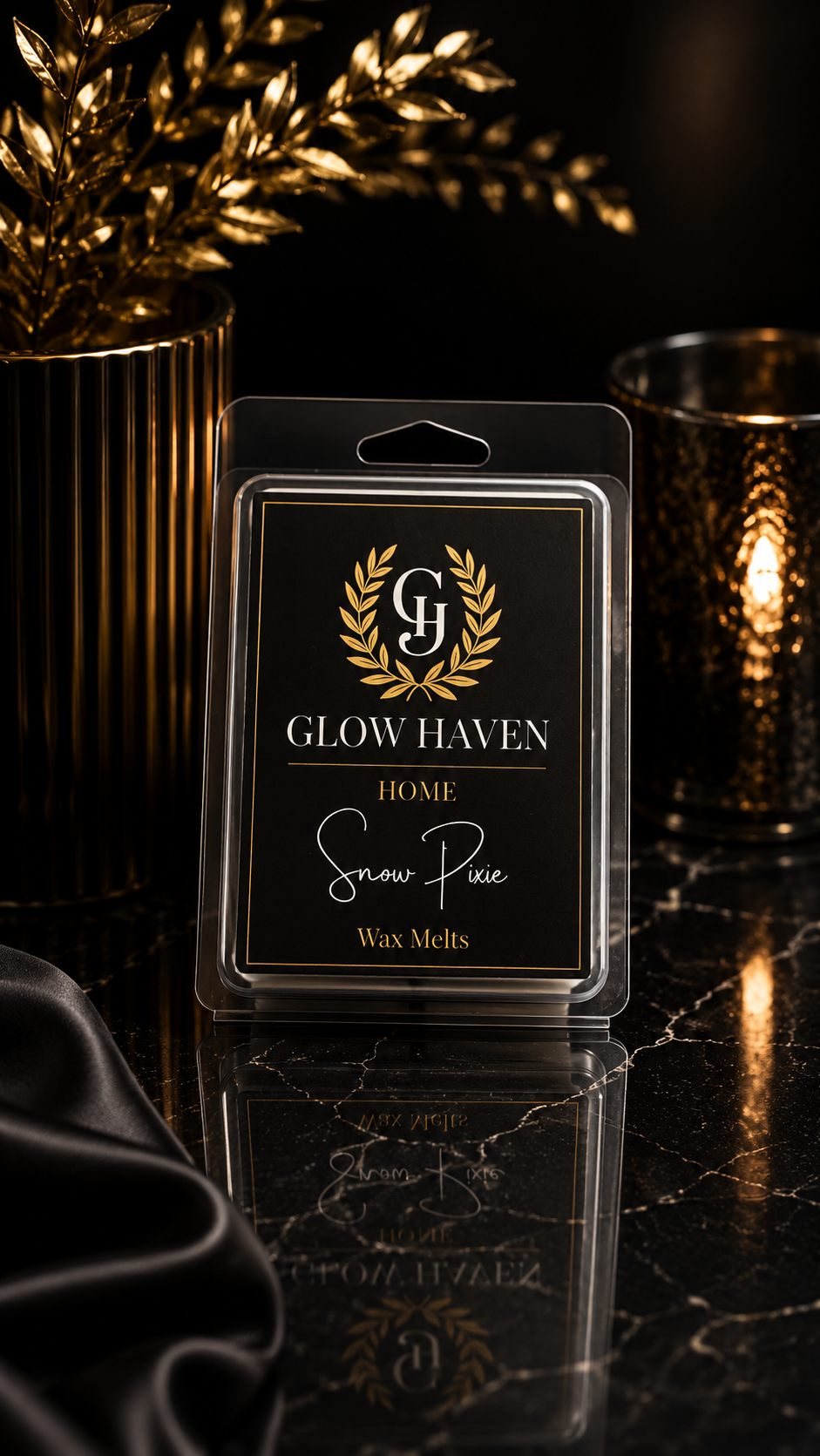 Glow Haven Snow Pixie clam shell wax melt in a black and gold labelled pack beside a glowing candle